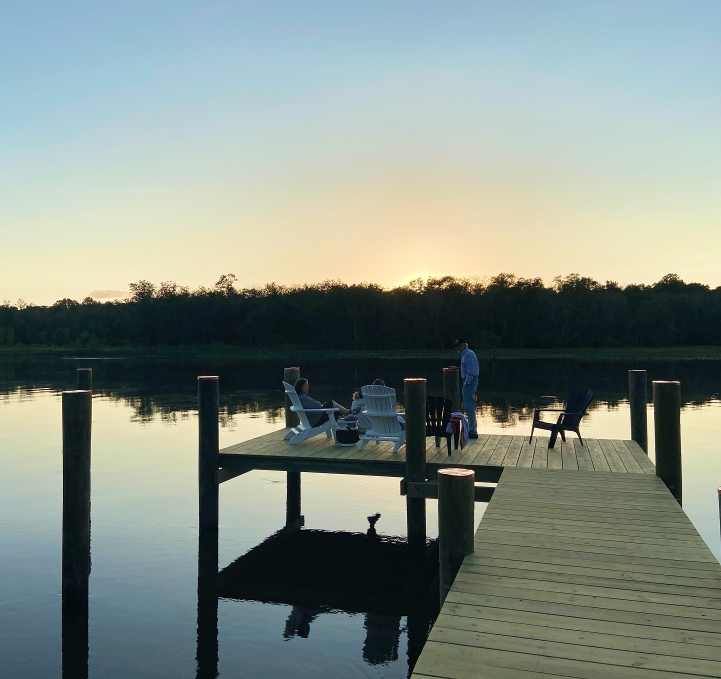 Family enjoying the sunset on their pier on the Choptank river.